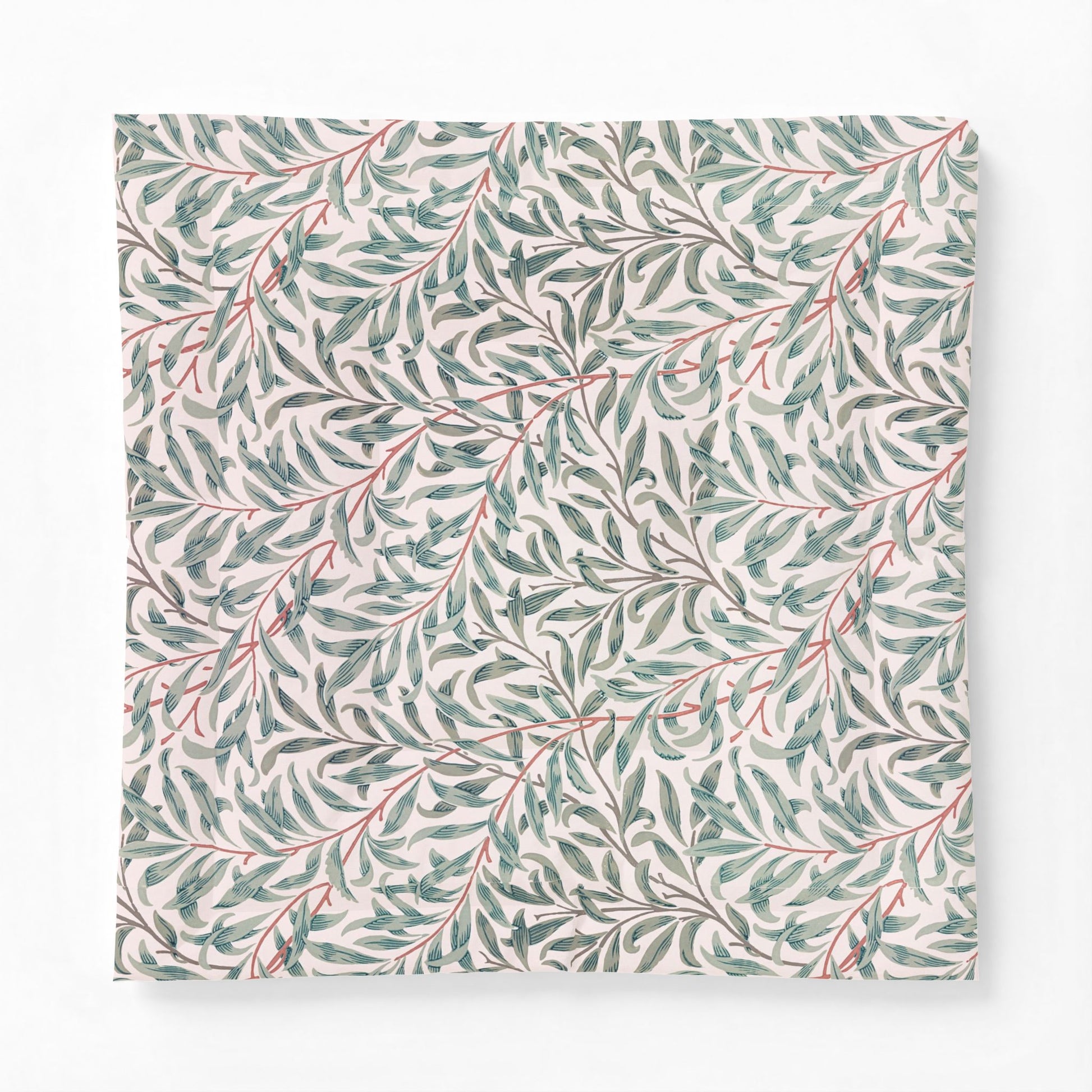 Patterned cotton comforter with green leaves and red stems on a white background