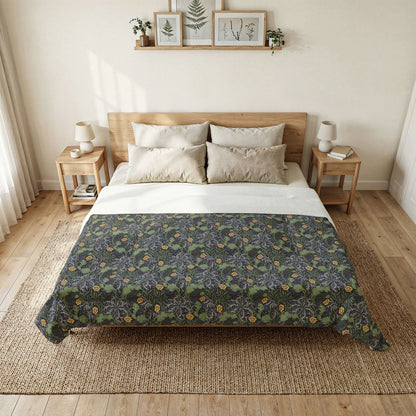 Bedroom with a bed featuring a floral patterned comforter, wooden headboard, and side tables.