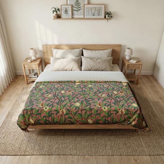 Bedroom with a bed featuring a green floral patterned comforter, wooden headboard, and side tables.