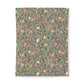 Patterned cotton duvet cover with floral and bird design on a pink background