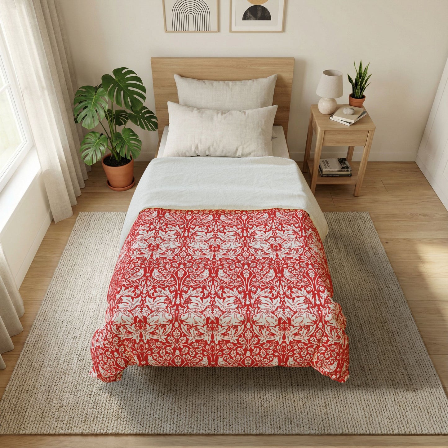 Bedroom with a bed featuring a red and white patterned comforter, nightstand, and plants.
