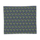 Floral patterned fabric with blue flowers on a green background