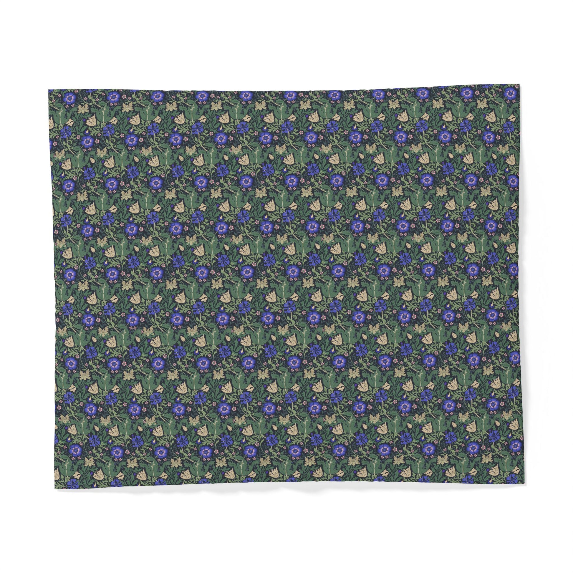 Floral patterned fabric with blue flowers on a green background