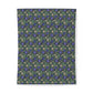 Floral patterned cotton duvet cover with blue flowers on a green background