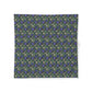 Floral patterned fabric with blue flowers on a green background