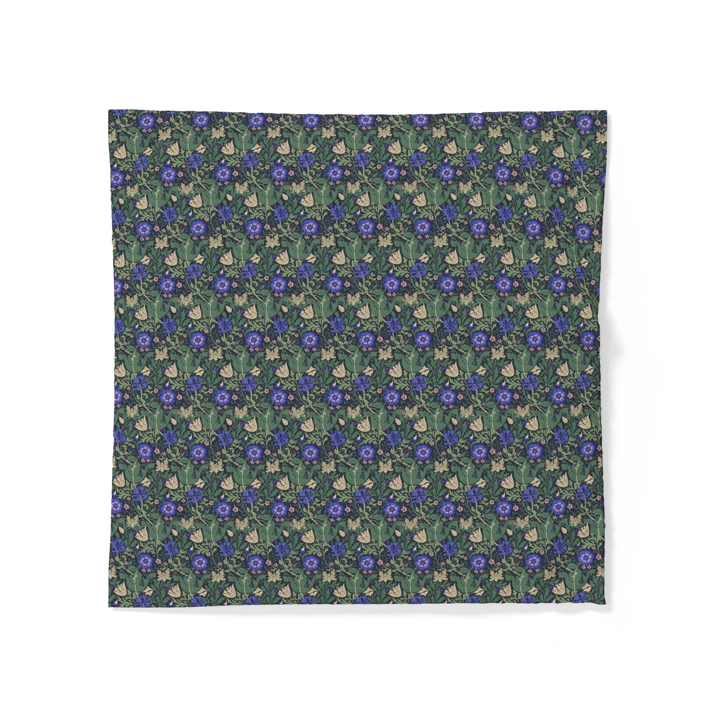 Floral patterned fabric with blue flowers on a green background