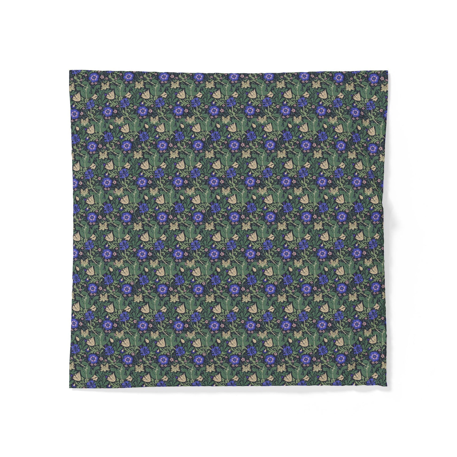 Floral patterned fabric with blue flowers on a green background