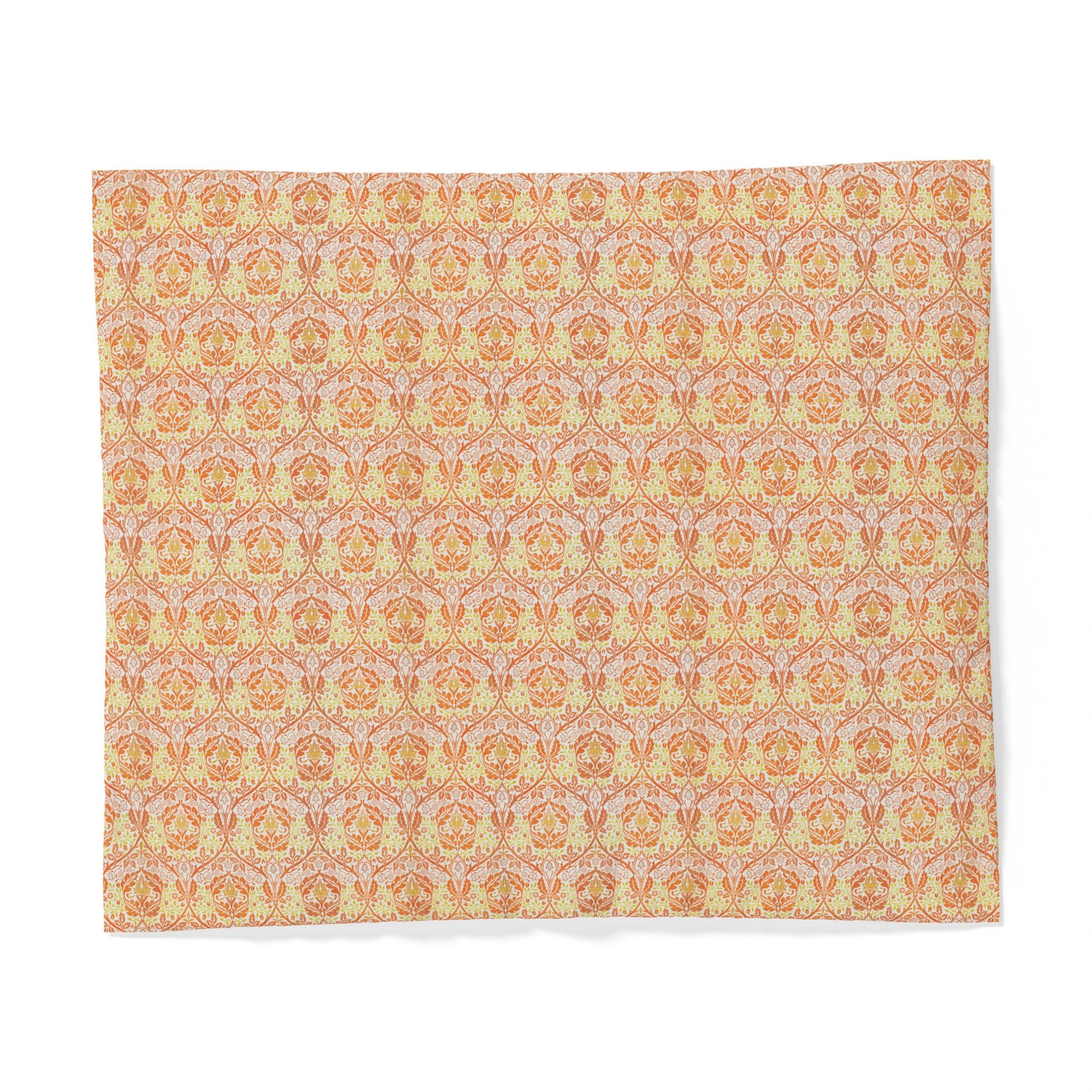 A square fabric placemat featuring a repeating ornate damask pattern in warm peach, orange, and pale yellow tones on a light pinkish-beige background, shown flat against a white background.