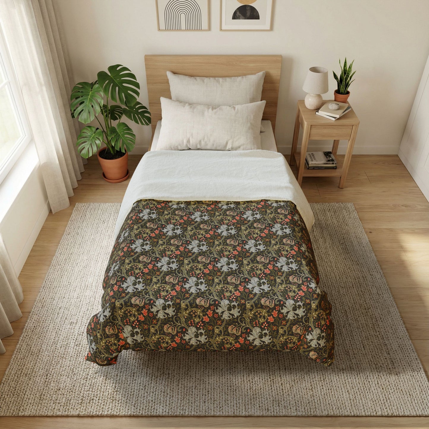 A neatly made bed in a bright, modern bedroom. The bedding set features a dark brown floral patterned comforter with white and orange accents, layered over white sheets and pillows, on a light wood bed frame.