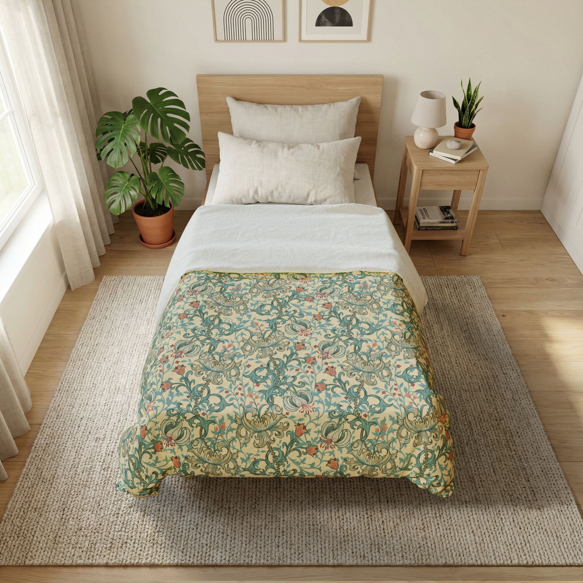 Bedroom with a bed featuring a striped duvet cover, nightstand with lamp and books, and plants.