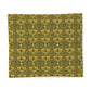 Patterned fabric swatch with green and yellow design on a white background