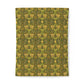 Patterned notebook with green and yellow design on a white background