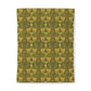 Patterned notebook with green and yellow design on a white background