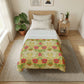 Bedroom with William Morris & Co floral comforter on bed, side table, and plants