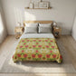 Bed with floral comforter in a bedroom setting