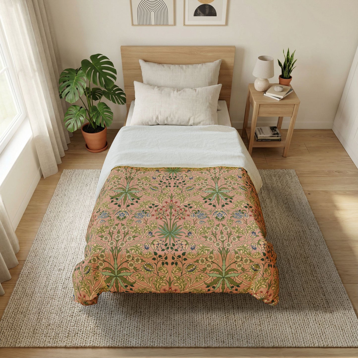Bedroom with a bed featuring a floral-patterned comforter, side table with lamp and books, and plants.