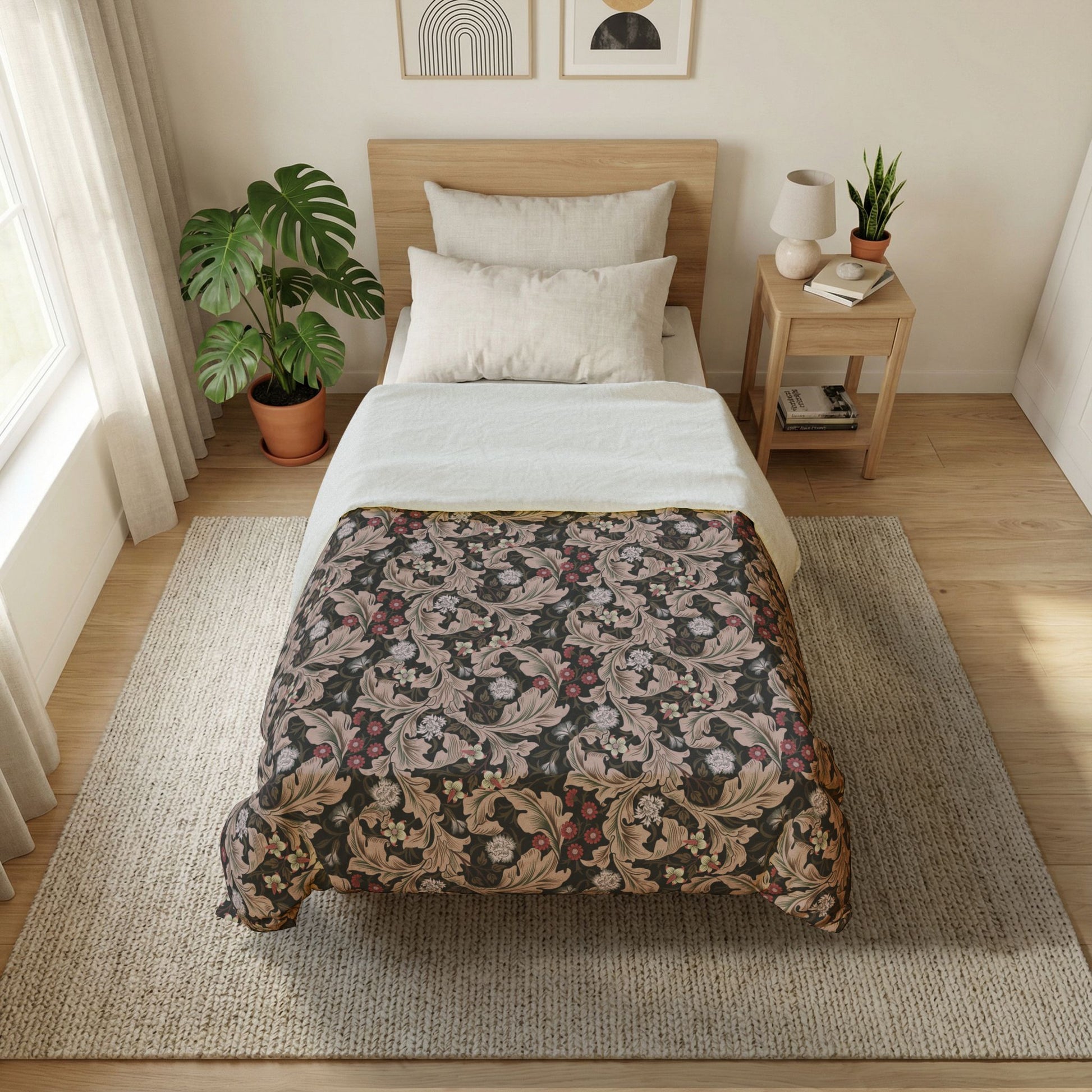 Bedroom with floral-patterned comforter on a bed, side table with lamp and books, and plants.