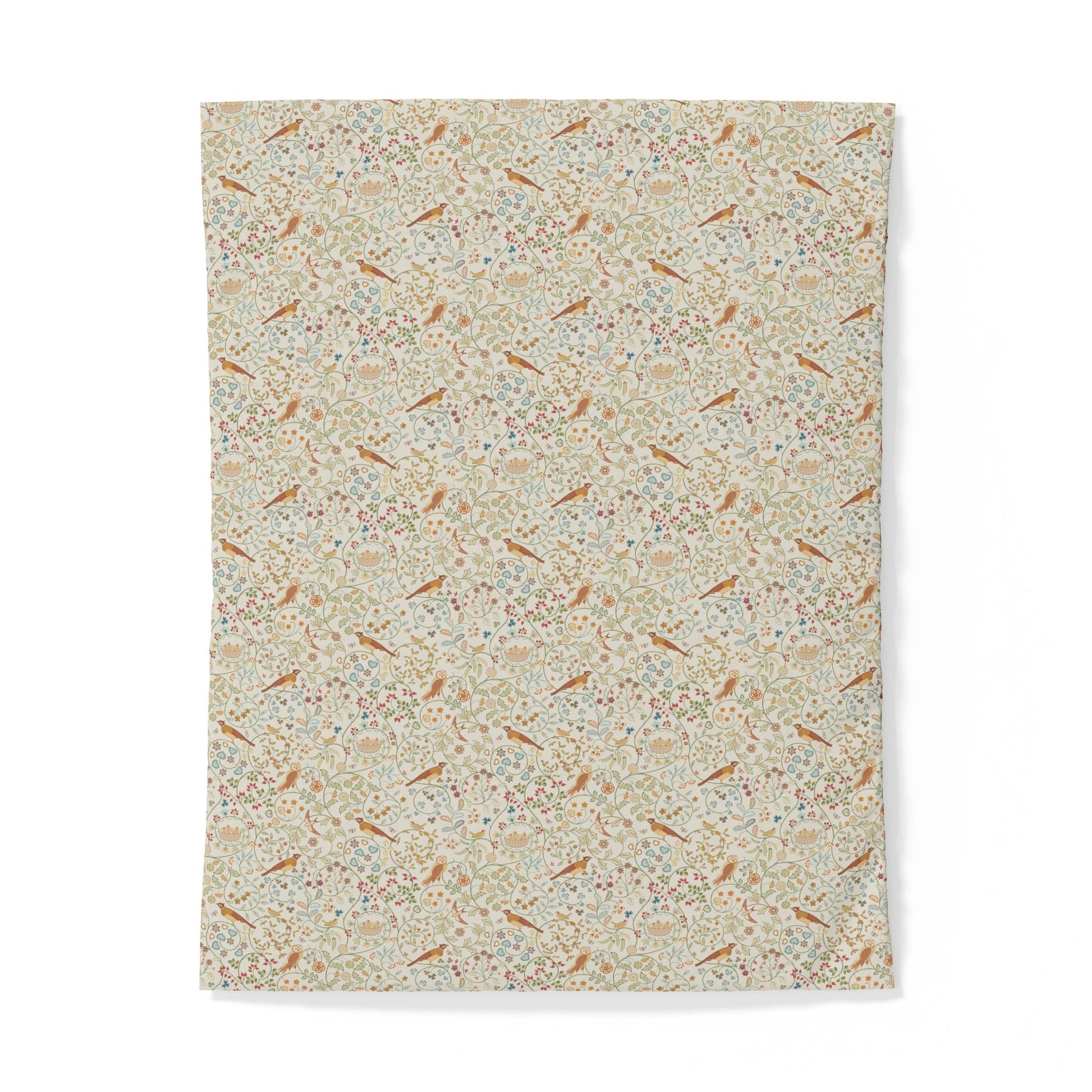 A rectangular fabric item, likely a tea towel or hand towel, featuring a dense all-over floral and botanical pattern in soft beige, cream, muted orange, and light blue tones, shown against a plain white background.