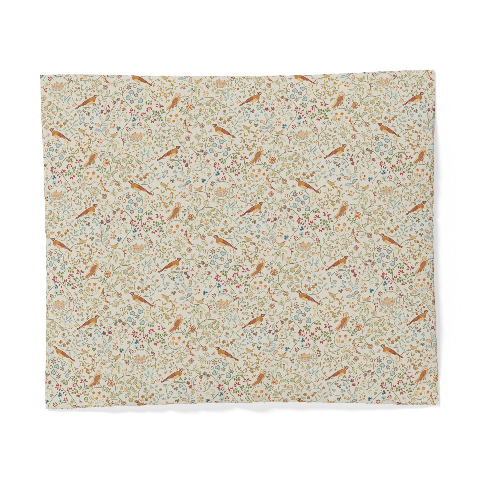 A square fabric item, likely a placemat or napkin, featuring a dense vintage-style botanical and bird pattern on a light cream background. The pattern includes muted green leaves, small blue and pink floral details, and scattered brown birds, all set against a clean white background.