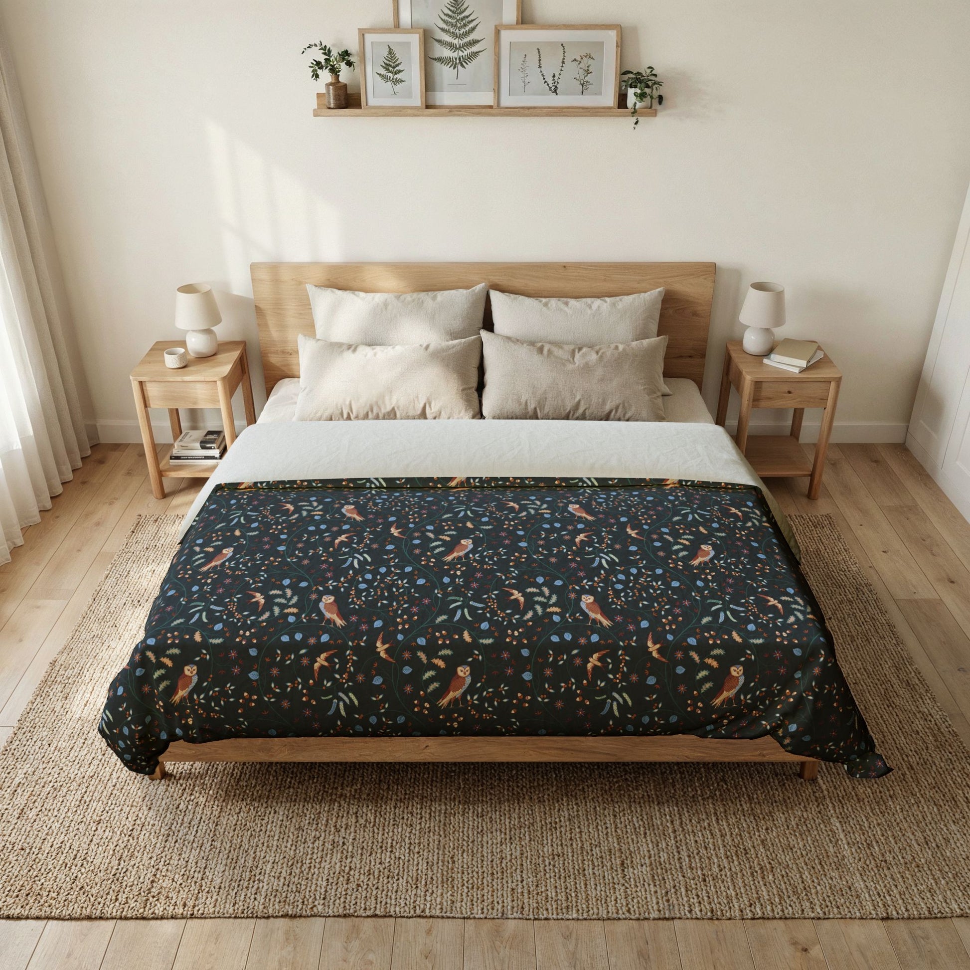 Bedroom with a bed featuring a patterned duvet cover, nightstands, and framed pictures on the wall.
