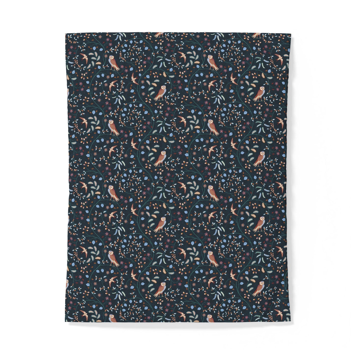A rectangular fabric item, likely a blanket or throw, featuring a dense all-over print of small birds, leaves, and dots on a dark navy background, shown against a plain white background.