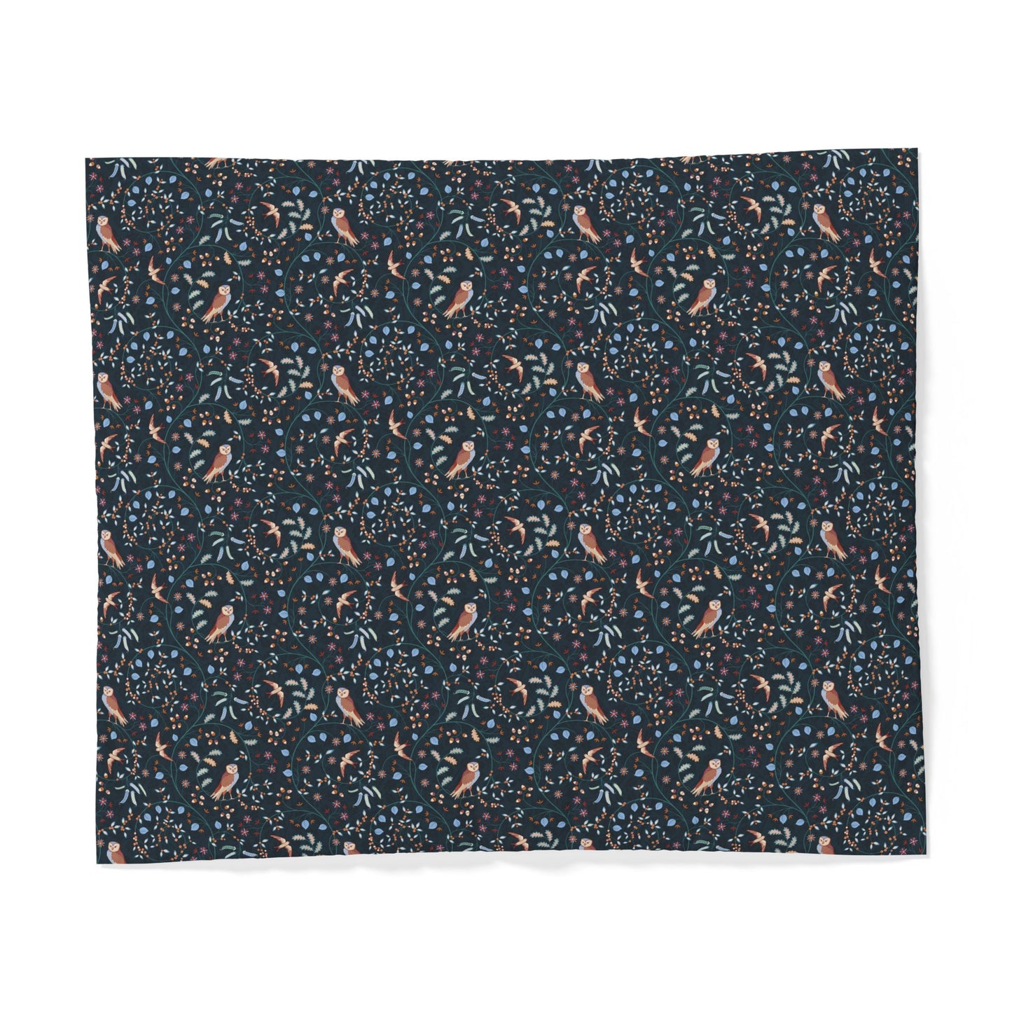 A square fabric sample or napkin featuring a dense botanical and bird pattern on a dark navy background, with small peach birds, blue leaves, and light blue dots.
