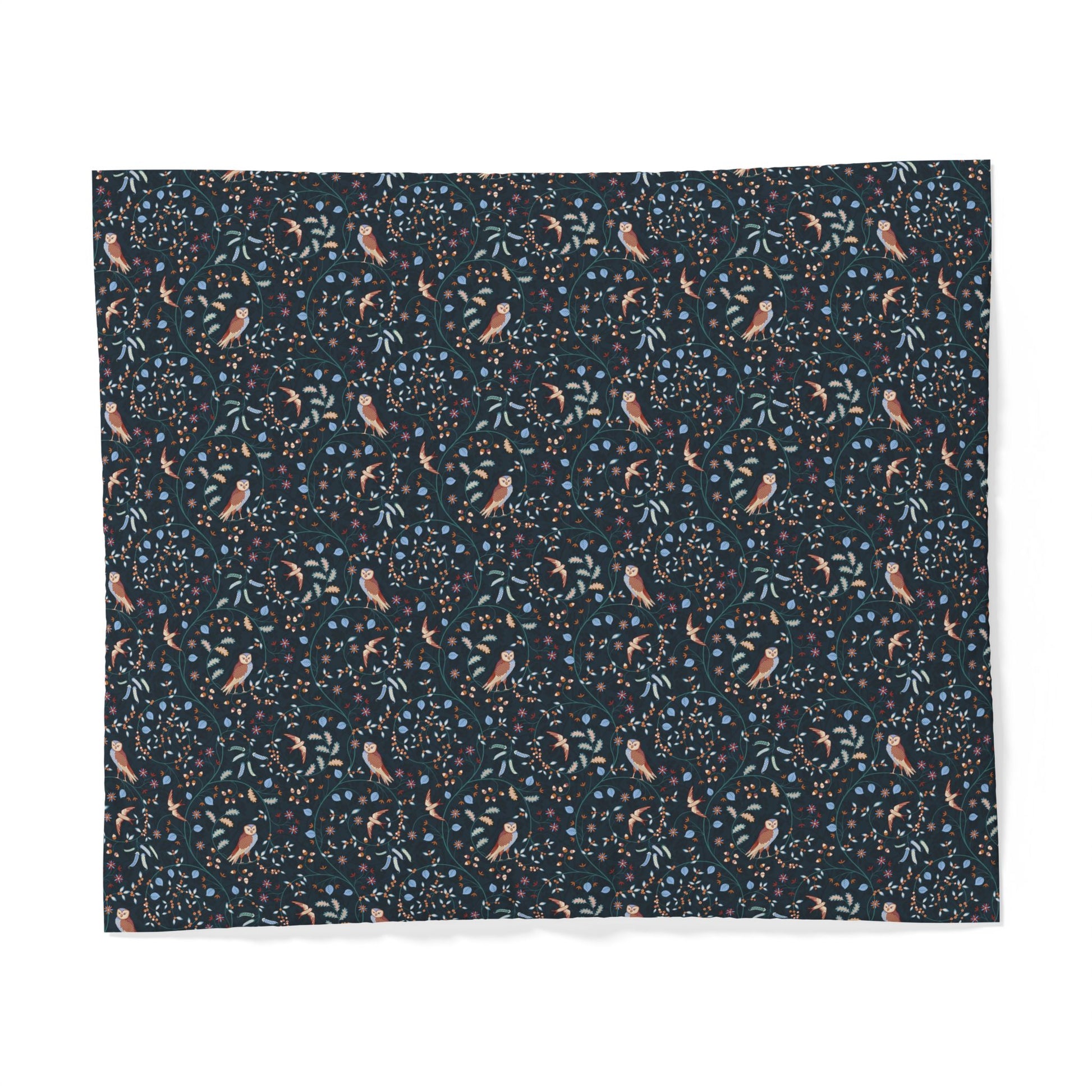 A square fabric sample or napkin featuring a dense botanical and bird pattern on a dark navy background, with small peach birds, blue leaves, and light blue dots.