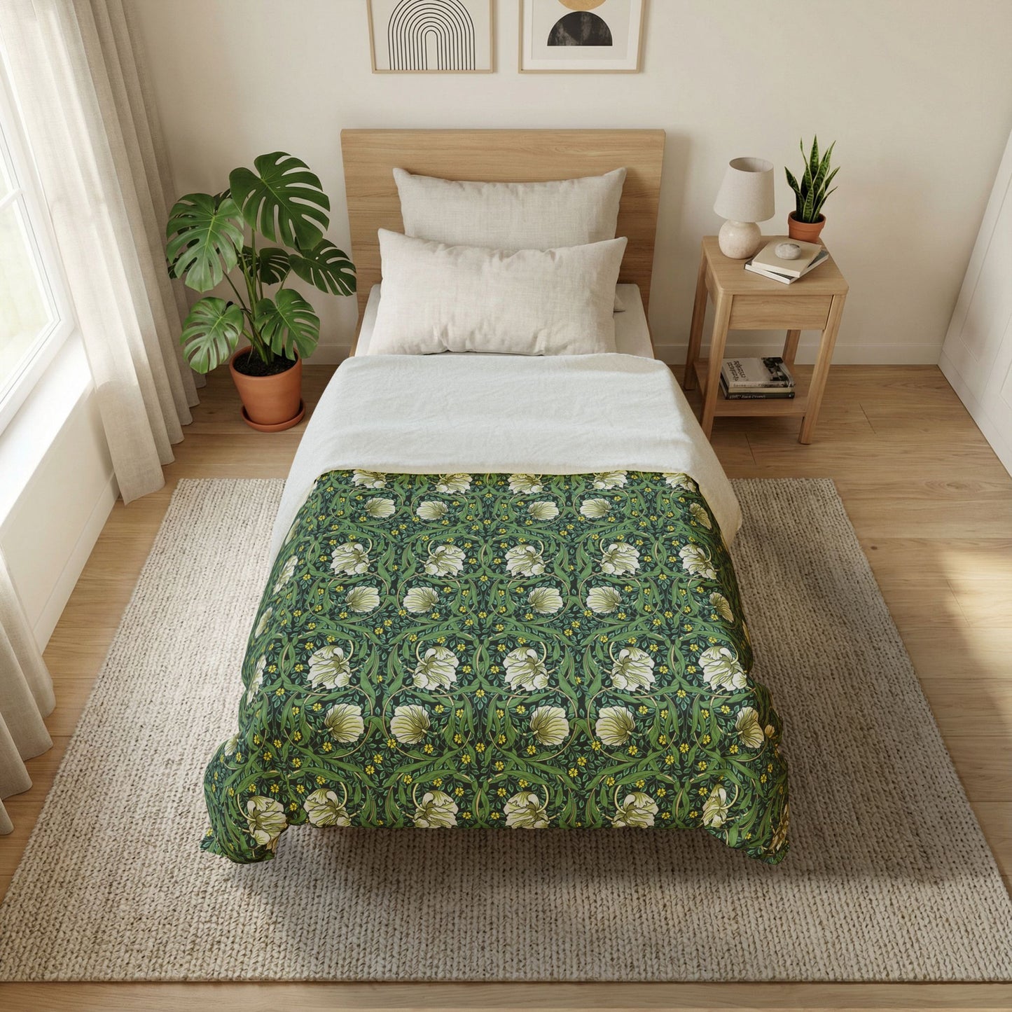 Bedroom with a bed featuring a green floral comforter, side table with lamp and books, and plants.