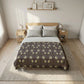 Bedroom with a wooden bed frame, gray bedding, and side tables.
