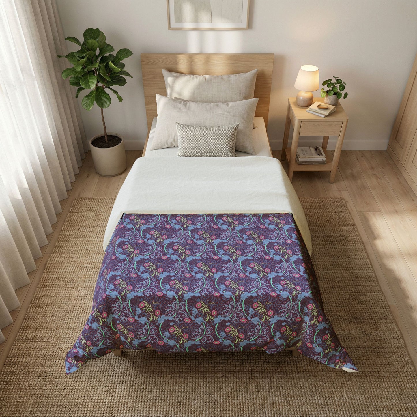 Bedroom with a bed featuring a floral comforter, nightstand, and plant.