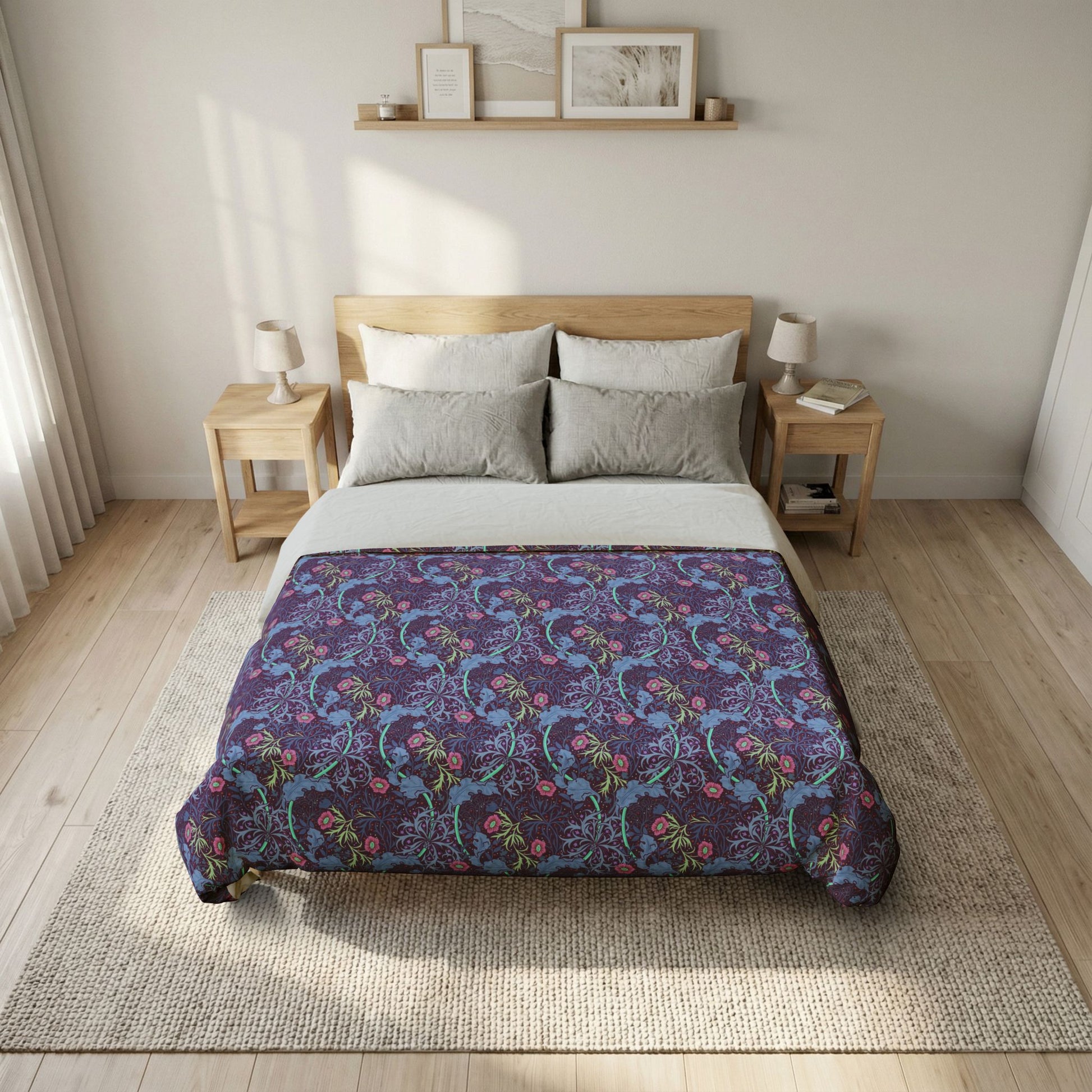 Bed with a floral patterned comforter in a bedroom setting