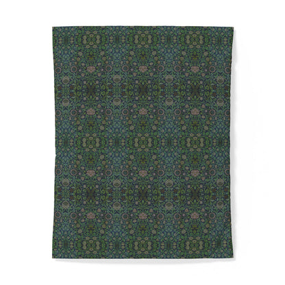 A rectangular textile or rug with an intricate, symmetrical floral and geometric pattern in shades of dark teal, forest green, and muted dusty pink, displayed flat against a clean white background.