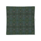Patterned fabric with blue leaves on a dark background