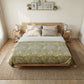 Bedroom with a wooden bed, green patterned duvet, and side tables with lamps.
