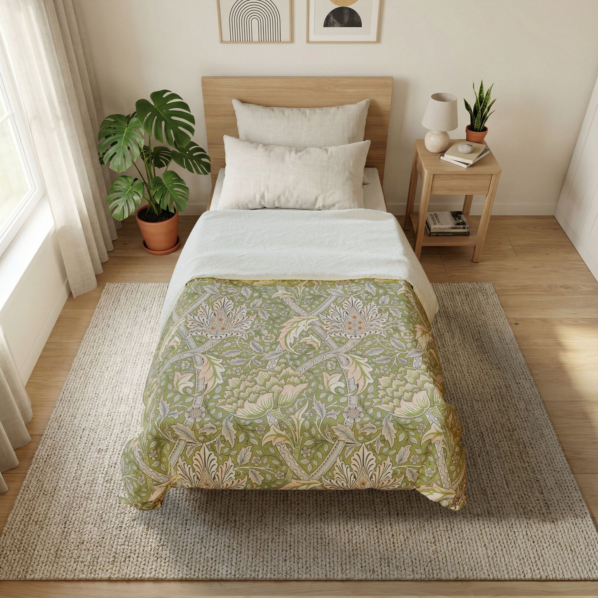 Bedroom with a bed featuring a green patterned comforter, nightstand, and plants.