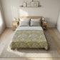 Bedroom with a bed featuring a green floral duvet cover, wooden headboard, and nightstands.