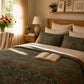 Cozy bedroom with floral bedding, pillows, and an open book.