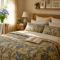 Bedroom with floral bedding, wooden headboard, and decorative elements.