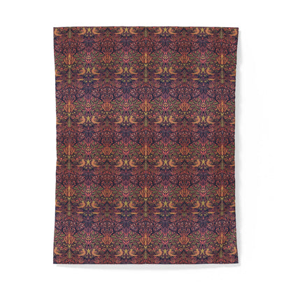 A rectangular textile product, likely a blanket or tapestry, featuring a dense, symmetrical Victorian floral pattern in deep burgundy, purple, and warm orange-brown tones, shown flat against a white background.