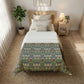 Bedroom with floral comforter, nightstand, and plants