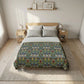 Bedroom with a bed featuring a floral patterned comforter, wooden headboard, and nightstands.