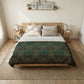 Bedroom with a wooden bed, patterned green blanket, and side tables with lamps.