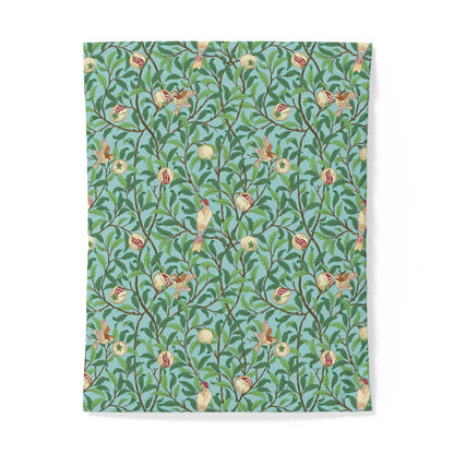 Floral and bird patterned paper with a green background