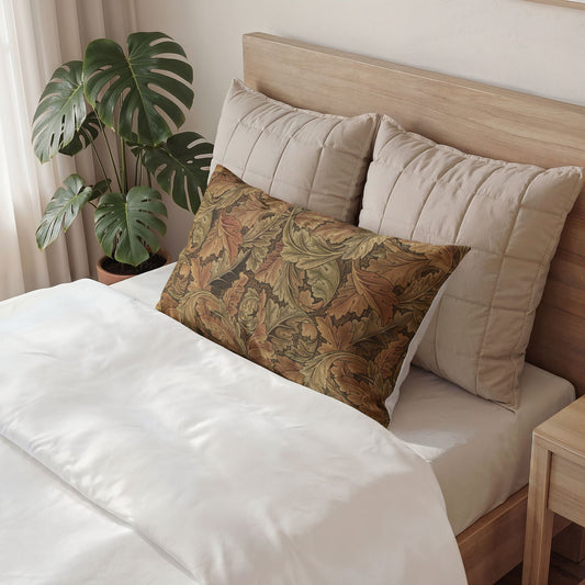 Bed with patterned pillow and neutral headboard, plant in the corner