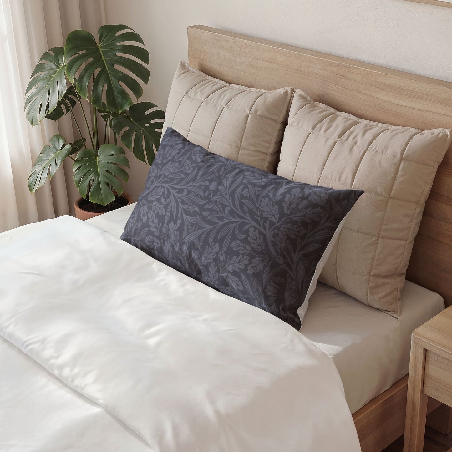Decorative pillow with a fist and hammer design on a bed in a bedroom setting.