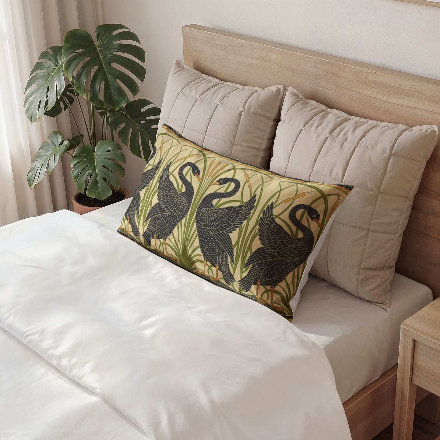 Decorative pillow with bird pattern on a bed in a bedroom setting