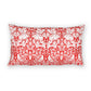 Decorative pillow with red and white floral and animal pattern on a white background