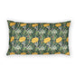 A rectangular lumbar pillow featuring a classic William Morris-style floral pattern with yellow flowers, green leaves, and winding vines on a dark green background, shown against a plain white studio backdrop.