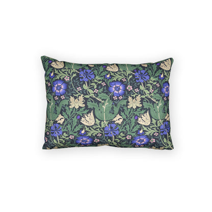 A rectangular decorative throw pillow featuring a dense floral and botanical pattern with blue-purple flowers, green leaves, and cream butterfly motifs on a dark background, shown against a plain white studio backdrop.