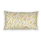 A rectangular throw pillow featuring a vintage botanical pattern of pomegranates, leaves, and flowers on a cream background, shown against a plain white studio backdrop.